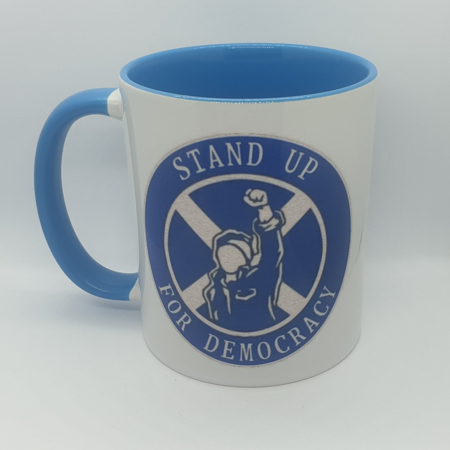 Stand up for democracy saltire fist in the air light blue rim and handled mug