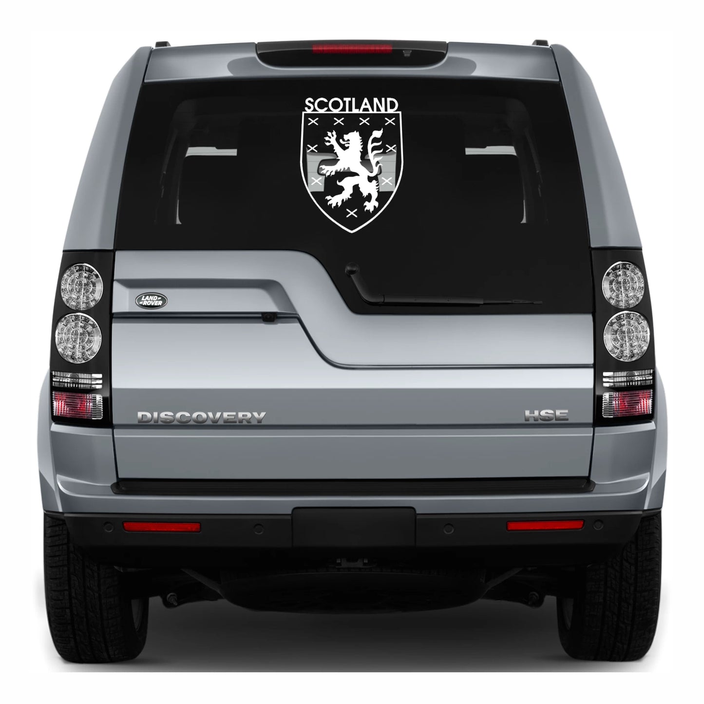 Back view of a Land Rover Discovery with a Scotland emblem decal on the glass.