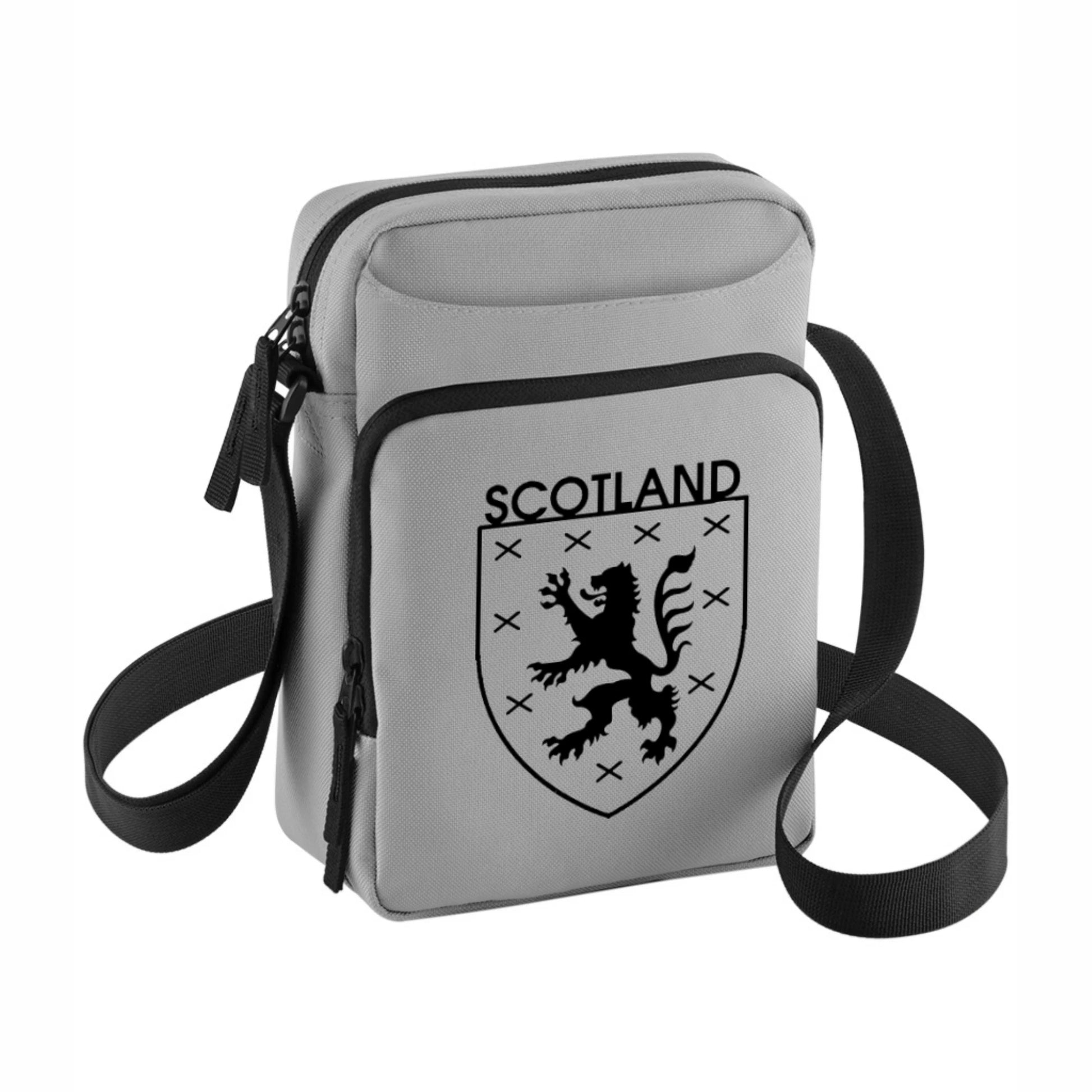 Grey crossbody bag with Scottish lion emblem on a grey background